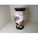 Lorna Bailey - a hexagonal vase decorated in the Fantasia Cottage pattern, signed to the base,