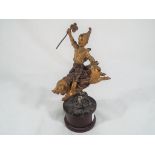 A Victorian cold cast bronze figure of a boy riding on a pig, 16.