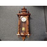 A Vienna style wall clock, walnut case with turned decoration,