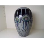 Moorcroft Pottery - a baluster vase entitled Peacock Parade, approx 17.