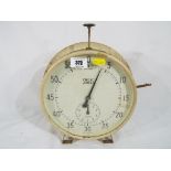 A white painted Smiths Timer showing seconds and minutes,