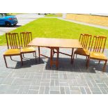 G Plan - A G Plan drop leaf table and four chairs 74 cm x 151 cm x 83 cm