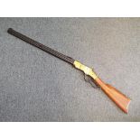 A replica Henry underlever rifle with moving underlever action