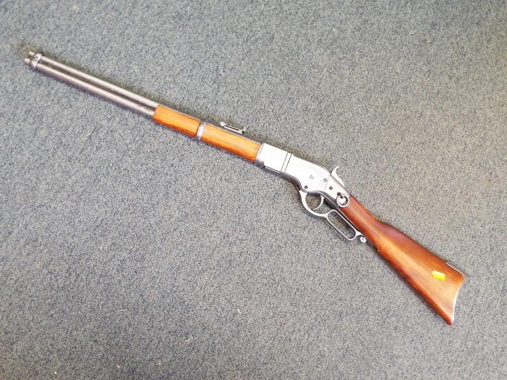 A replica Winchester underlever rifle with moving underlever action