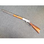 A replica Winchester underlever rifle with moving underlever action