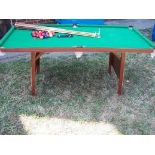 A half size snooker table with fold out legs with balls and 2 cues and a table tennis board with
