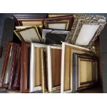 A good lot to include 24 picture frames of varying sizes