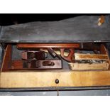 A vintage wooden tool chest containing a quantity of good quality vintage wooden planes and various