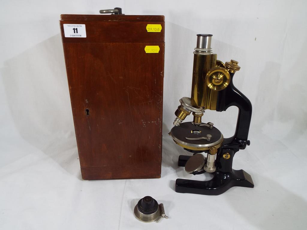 A C. Reichert Wien boxed tripod microscope marked No. 67424.