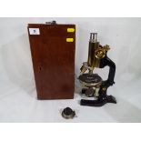 A C. Reichert Wien boxed tripod microscope marked No. 67424.