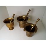Three brass pestle and mortars - Est £20 - £30