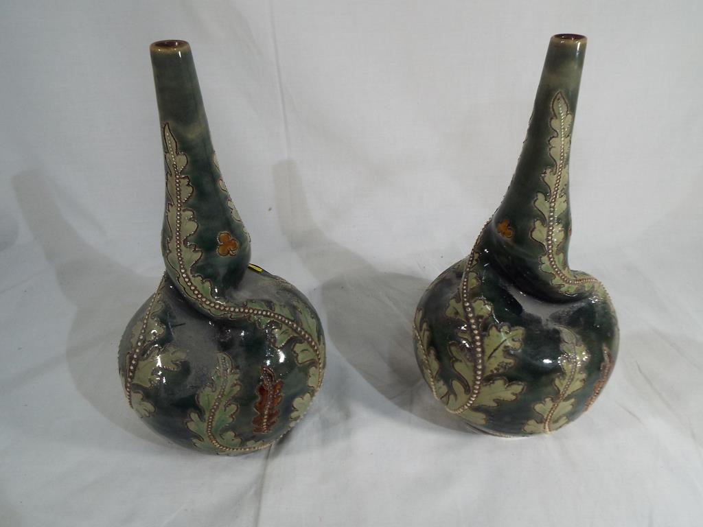A pair of Doulton Lambeth salt glazed twist vases circa 1890 - 1910.