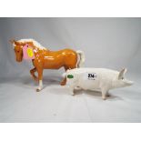 Beswick Pottery - two figurines comprising Boar Ch Wall Champion Boy 53rd # 1453A and a Palomino