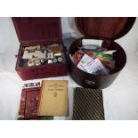 A vintage sewing box and contents and a vintage hat box containing sewing equipment (2).