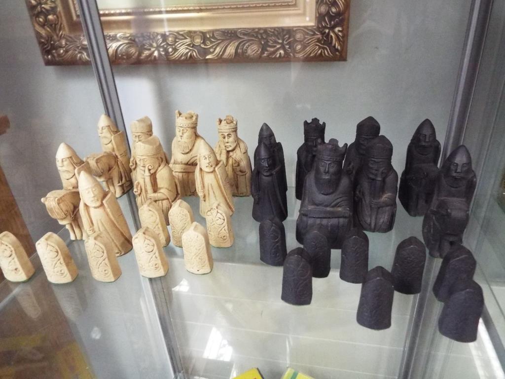 A set of Isle of Lewis chess pieces made from carved saop stone.