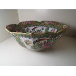 Asian ceramics - a large Famille Rose pedestal bowl with frilled rim, character marks to the base,