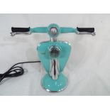 An unusual table lamp in the form of a Lambretta scooter, 28 cm (h).