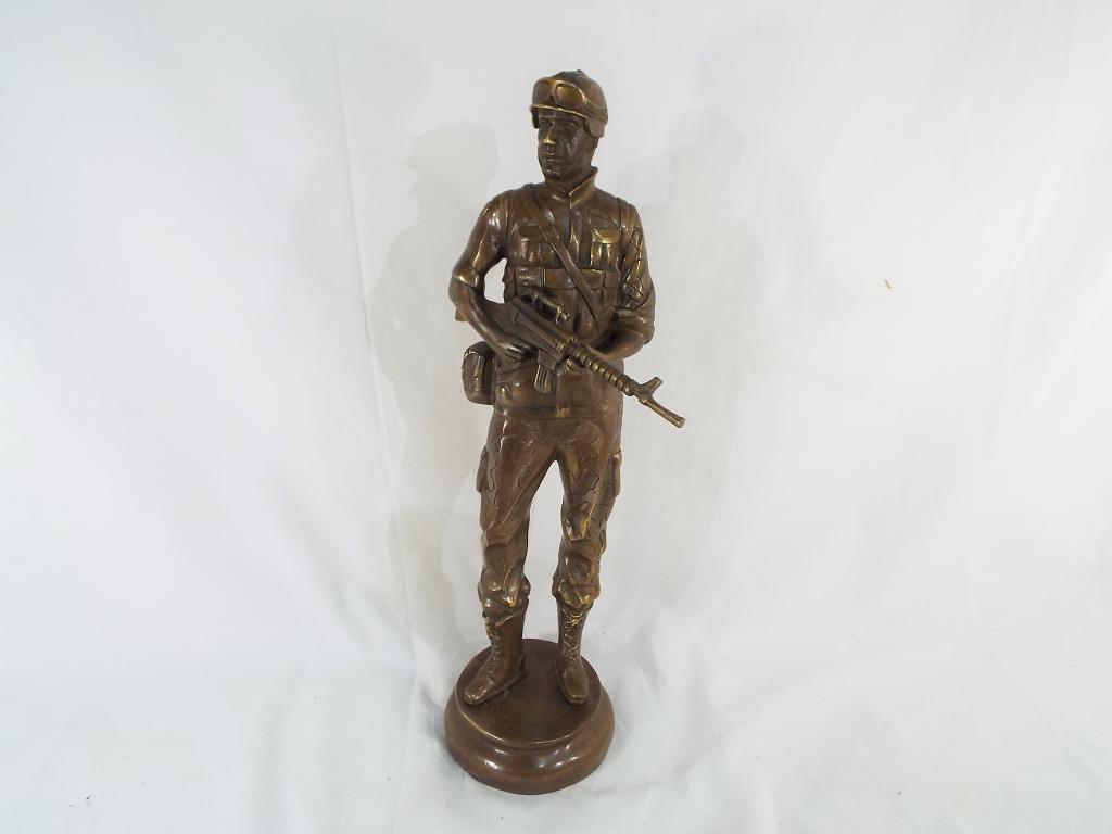 A brass soldier in full uniform 40 cm (h).