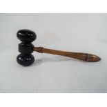 A carved wooden gavel