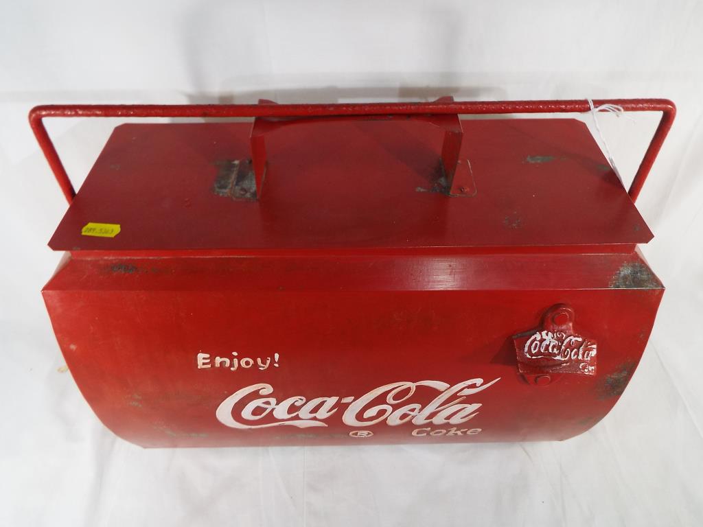 A metal cool box advertising Coca Cola, approximate height 38 cm x 44 cm x 24 cm.