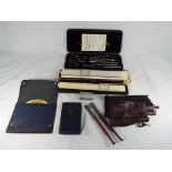 A cased set of drawing instruments,