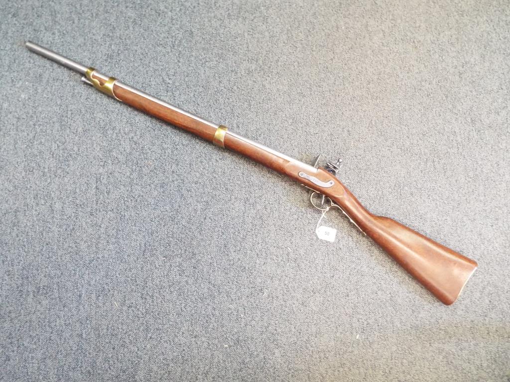 A replica French sporting flintlock rifle with working action