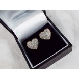 A pair of 9 carat gold stud earrings set with 50 pt 1/2 ct diamond cluster, heart shaped,