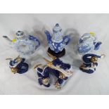 Three tea pots in blue and white,