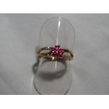 A lady's hallmarked 9 carat gold, red stone and diamond ring, approximate weight 2.