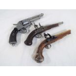 Two replica flintlock pistols and a replica .