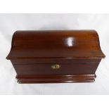 A Georgian mahogany box with fitted interior and detailed lions' heads/handles.