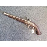 A replica flintlock blunderbus pistol with working action