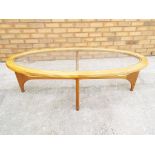 A 1970's retro glass top coffee table with makers mark "Stateroom" 41 cm x 130 cm x 58 cm.