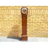 A granddaughter clock, oak cased Art Deco style, Smiths three train Westminster chiming movement,