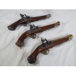 A set of three replica flintlock coach blunderbus pistols with working actions