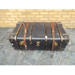 A large vintage travelling trunk 34 cm x 94 cm x 54 cm