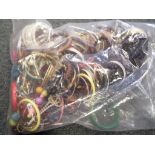 A sealed bag of unsorted pre-owned costume jewellery, approx weight 2.