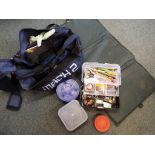 A good quality Shakespeare holdall fishing bag, containing 3 bait boxes, a fishing box with weights,