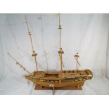 A scratch built wooden model of a ship.