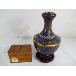 A good quality cloisonne vase approximate height 22 cm and a vintage box containing two sets of