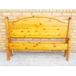 A pine framed double bed