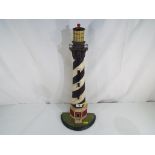 A good quality cast iron model of a lighthouse 54 cm (h)