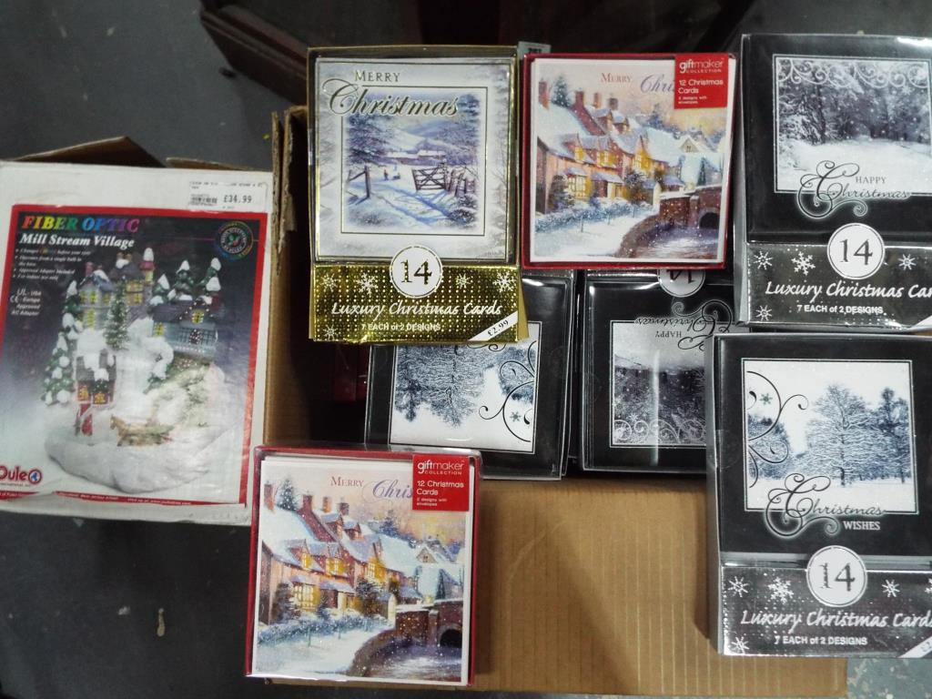 A large collection of unopened Christmas Card packs,