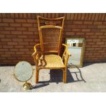 A good quality wicker arm chair and a gilt framed wall mirror size 75cm x 48cm and an oval makeup