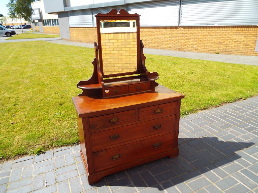 A mirror backed chest of drawers, two over two by Co-operative Cabinet Makers Ltd,