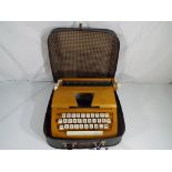 A early Petite typewriting with carry case