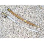 An Indian sword in scabbard,