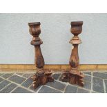 A pair of wooden floor sconces,