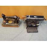 A vintage typewriter by Royal and a Singer sewing machine,