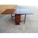 A drop-leaf table 76 cm (h) x 152 cm x 90 cm